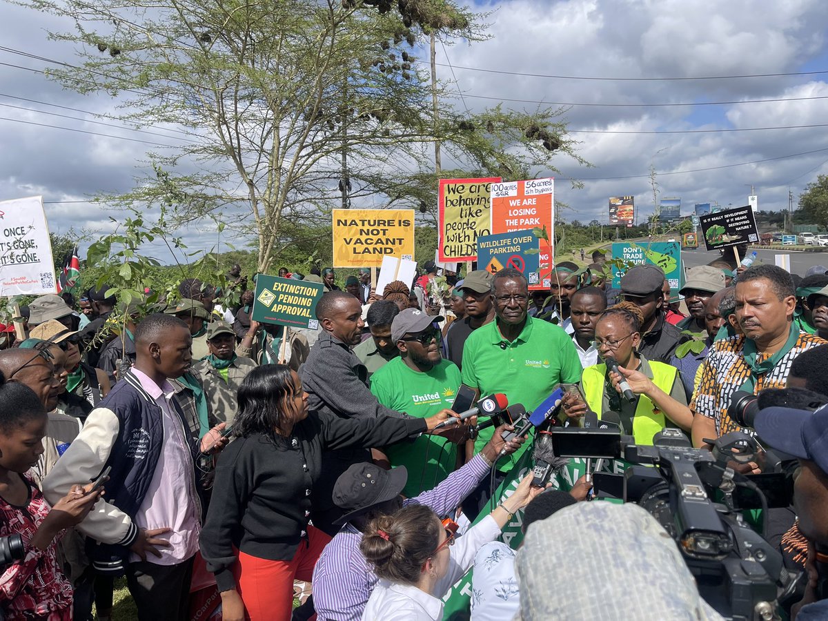 GreenBeltMovmnt's tweet photo. #NairobiNationalPark is not a parking lot.
Today, we stood against plans to excise 90 acres of protected park land for a 1,300-car parking facility. Nine unarmed activists were arrested during the peaceful protest.
Protect nature. Defend civic space.

#NationalParkNotCarPark https://t.co/05bYaeSAei