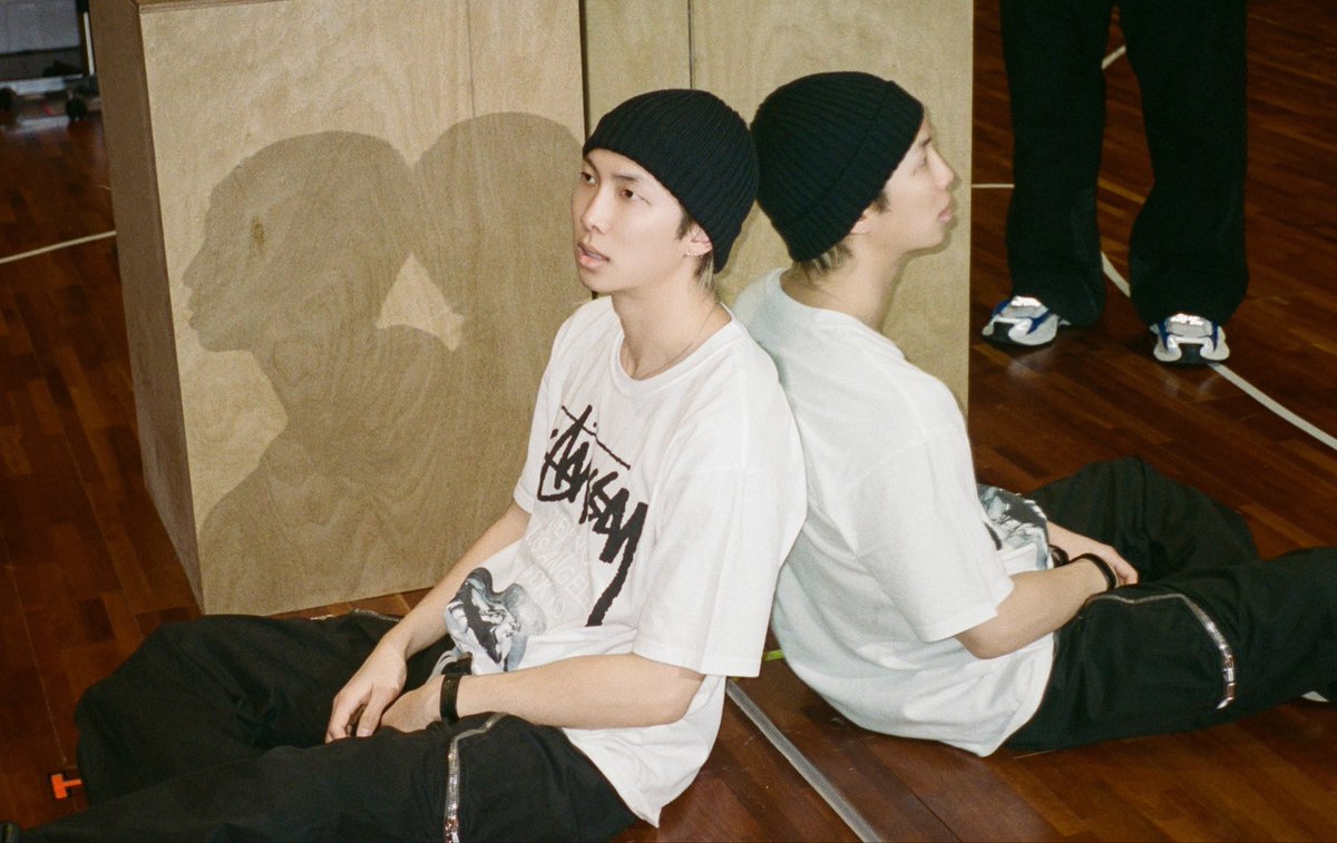 nyhsjtjbts's tweet photo. this photo feels like the epitome of namjoon. his shadow, his reflection and him in the middle; existing somewhere between where the light finds him and how the world sees him https://t.co/QpbnrwJy9W