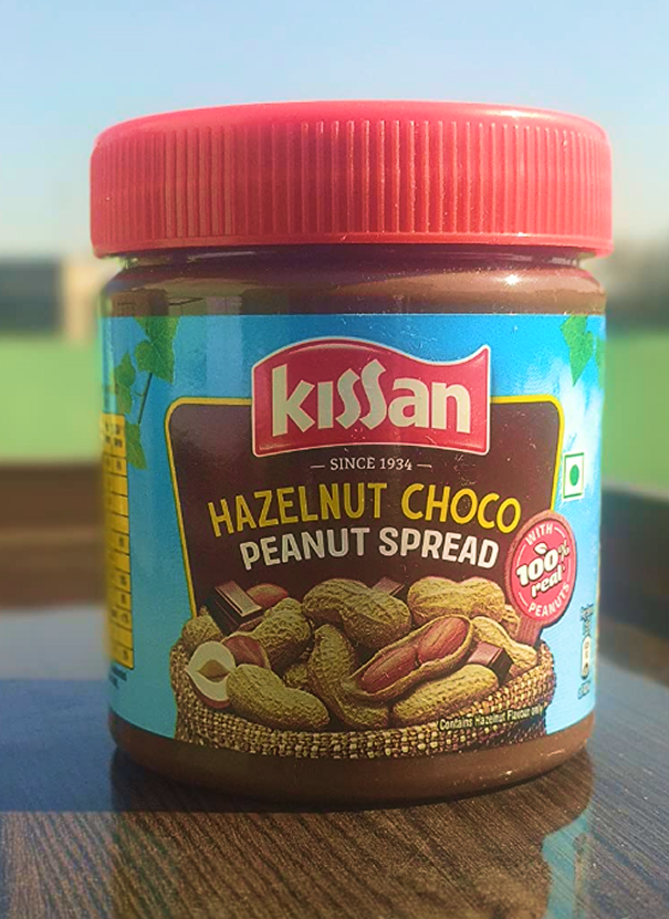 NalinisKitchen's tweet photo. Both are spreads.

INDIA:
Kissan's Hazelnut Choco Peanut Spread doesn't even contain hazelnuts. Instead, it uses nature identical hazelnut flavouring substances.

UK:
Pip & Nut's Chocolate Hazelnut Spread contains 24% hazelnuts.

We're being misled. If a product uses "hazelnut" in its name, it should actually contain hazelnuts.

It's a stupid common thing. Anyone can understand. I don't know how big ministers and educated officials keep allowing brands to market products this way.