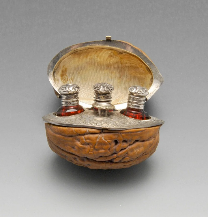 wikivictorian's tweet photo. Hinged walnut case with three scent bottles and a funnel, 19th century. France. In private collection. https://t.co/p4iOLRV71v