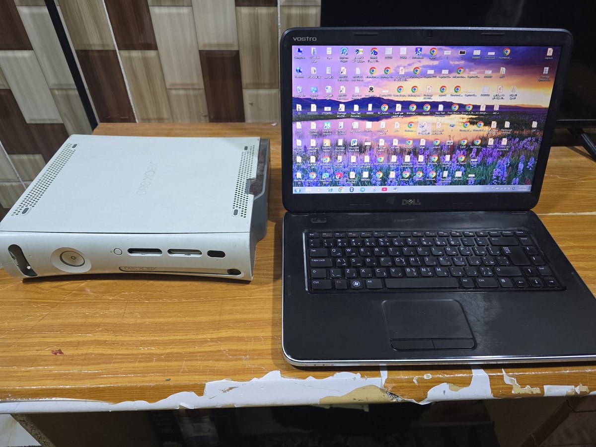 Medooo9912's tweet photo. Watching everyone get the green Series X from @asha_shar at FanFest while I’m in Iraq surviving on a Win 7 Dell &amp; my loyal Xbox 360! 😅🏗️
​Studying Civil Engineering while my laptop sounds like a jet. Time to retire the museum setup? 🎮💻 @Xbox @XboxP3 #XboxFanFest https://t.co/13YhERlF7A