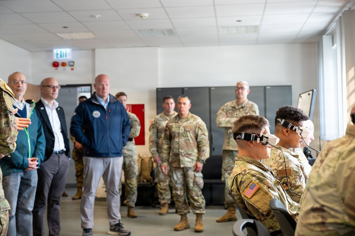 USAmbNATO's tweet photo. Proud to stand with the elite troops at U.S. Army Garrison Bavaria and the 7th Army Training Command, who are a powerhouse for ensuring readiness for all American forces in Europe. It was an honor to meet with our troops who are testing game-changing tech to keep America safer. Godspeed in your mission!