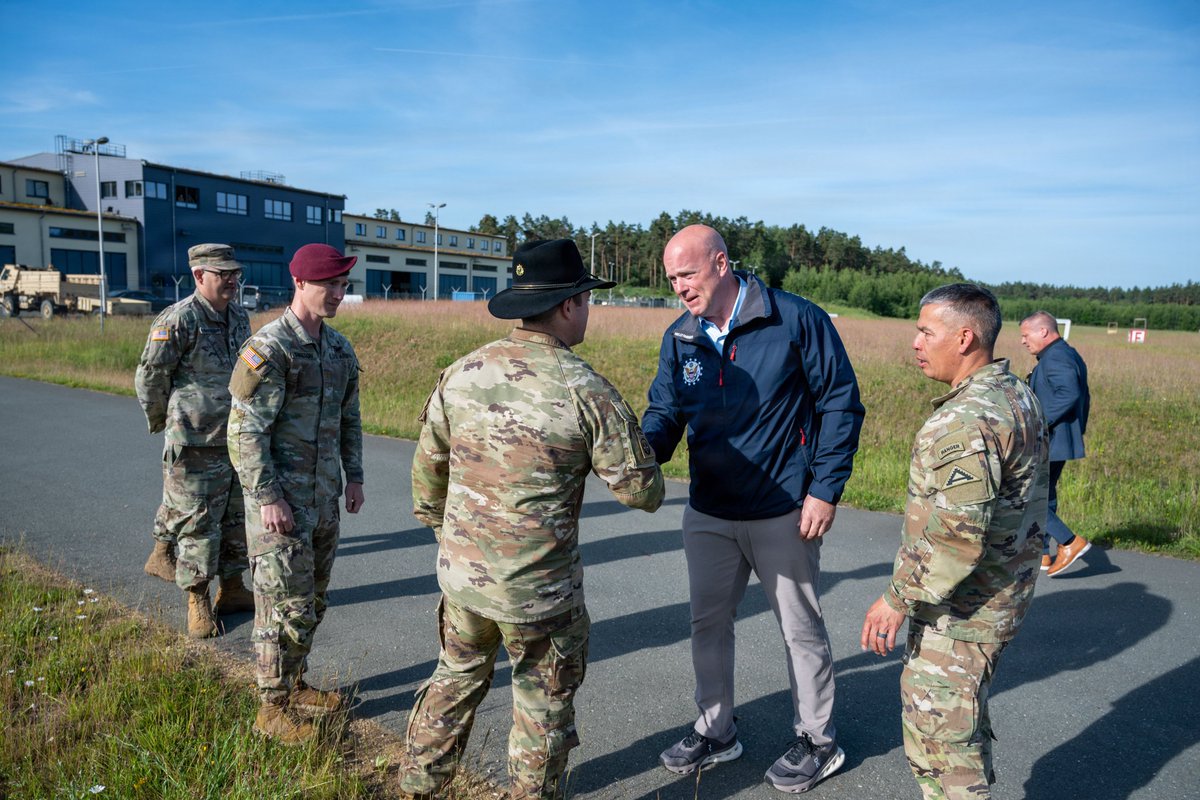 USAmbNATO's tweet photo. Proud to stand with the elite troops at U.S. Army Garrison Bavaria and the 7th Army Training Command, who are a powerhouse for ensuring readiness for all American forces in Europe. It was an honor to meet with our troops who are testing game-changing tech to keep America safer. Godspeed in your mission!