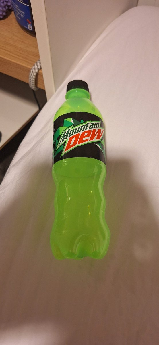 Lemongrab12's tweet photo. @MountainDew I enjoy the Philippines MD bottle, it looks like it's almost glowing. Not as sweet or carbonated as the stuff from home back in Canada https://t.co/TJ9mUv8nuL