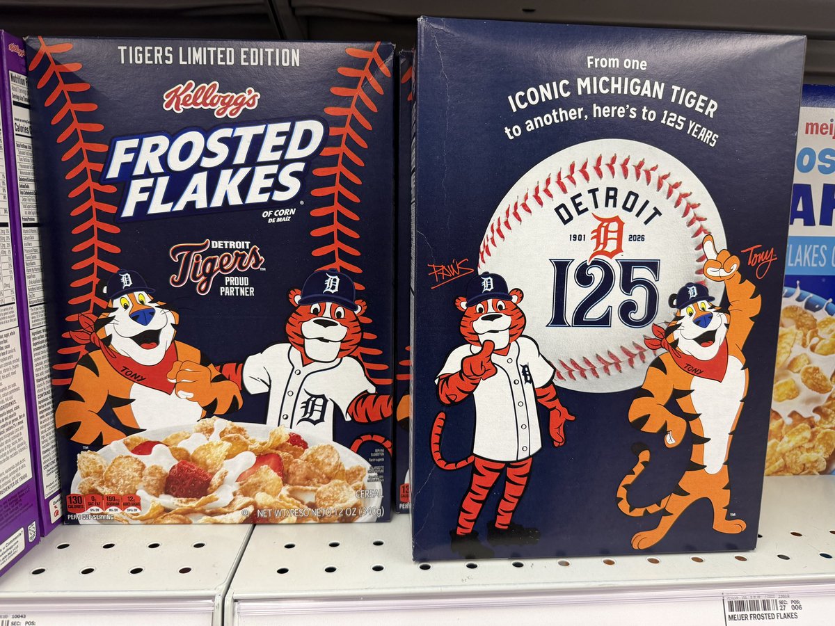 Lansdead's tweet photo. We got excited about this @tigers x @KelloggsUS box with @PAWSDetroit on the cover last night. Then noticed pretty quickly they likely made Paws with AI… seriously guys? The eyes, mouth shape, right armpit and inconsistent blurry  shirt buttons really give it away. SMH 🤦🏻‍♂️ https://t.co/NrUsRAJOoJ