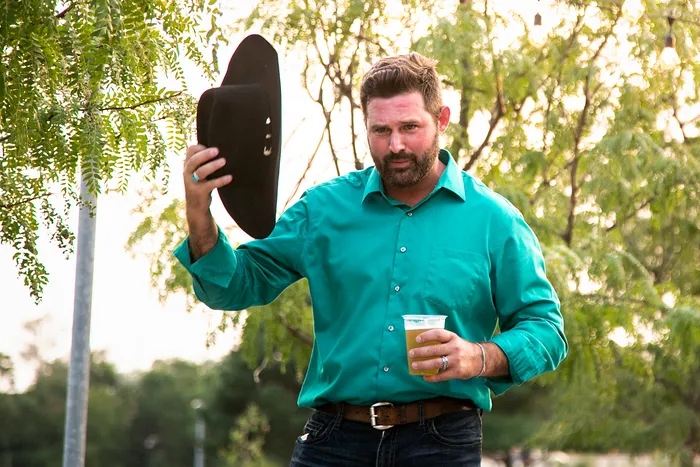 NE02Dem's tweet photo. Every photo of this guy on Google Images is just him with a beer in hand and a 10-gallon hat on his head. This is how Dems flip Iowa. https://t.co/5cJRNjodQn