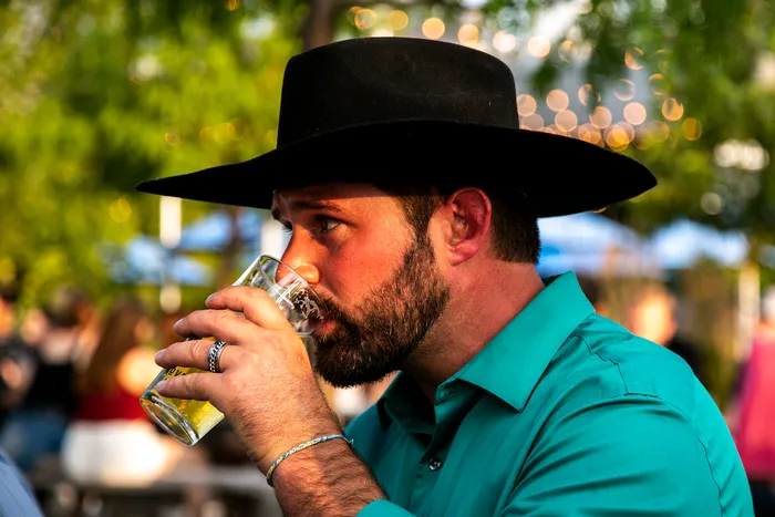 NE02Dem's tweet photo. Every photo of this guy on Google Images is just him with a beer in hand and a 10-gallon hat on his head. This is how Dems flip Iowa. https://t.co/5cJRNjodQn