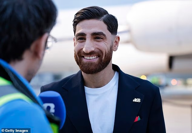 MarioNawfal's tweet photo. 🇮🇷🇺🇸 Iran's World Cup squad landed in Mexico wearing pins bearing the number 168.

Not a jersey number. A body count. The 168 children killed when a U.S. missile hit a school in Minab on February 28th. Most of them were young girls.

The strike was later confirmed to be a U.S. military mistake. 175 people total died.

Now the same country that launched that strike is hosting Iran at SoFi Stadium in Los Angeles on Monday.

The players didn't need a press conference. They let the pins do the talking.

This is the first World Cup in history where a host nation is fielding a team from a country it's actively at war with. The optics were already impossible. Iran just made sure nobody looks away.

Source: Daily Mail/Writer: Jamie