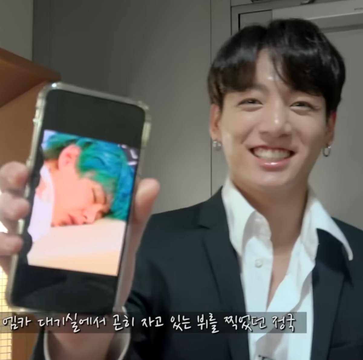 koogifs's tweet photo. jungkook proudly showing pictures of his hyungs  😭 https://t.co/cSZUZPl4LO