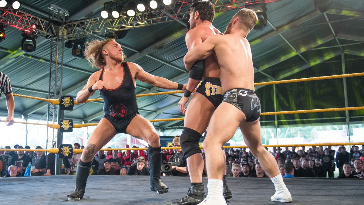 NXTUK_Legacy's tweet photo. June 8, 2018:
At Day 1 of Download Festival in Donington Park, #TylerBate and United Kingdom Champion @PeteDunneYxB defeated #WWENXT Tag Team Champions @KORcombat & @roderickstrong by disqualification.
๐ธ WWE
#NXTUK | #NXTDownload https://t.co/VssFKazQmx