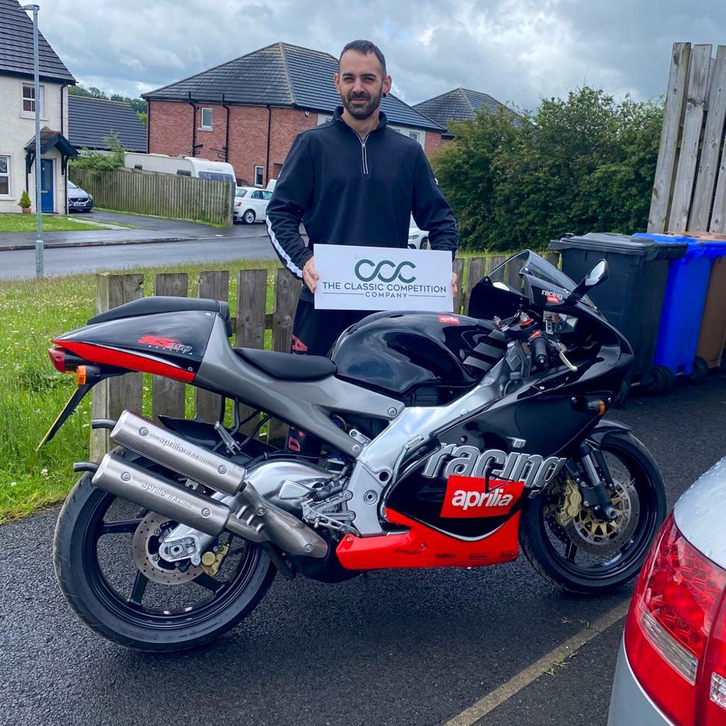 Theclassiccomp's tweet photo. 🍾 What a WIN! 🏆 

When we called Kieran to say that he had won a 2000 Aprillia RS250 he was absolutely blown away as you can expect! We organised the delivery over to Northern Ireland and a couple of weeks later she arrived! https://t.co/uHNz0fAspw