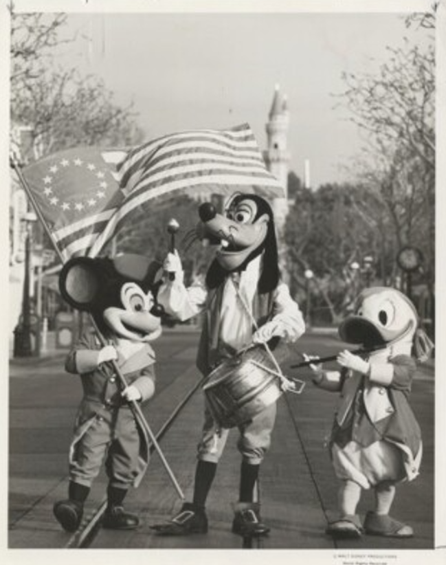 archivesfdn's tweet photo. In 1976, Mickey, Donald, and Goofy suited up in colonial attire for America's Bicentennial. With the 250th just weeks away, this gem from the @usnatarchives feels right on time. Oh, and happy 92nd to Donald Duck, who debuted on this day in 1934! 🦆🎉 #America250 @DisneyParks https://t.co/cI9vuqKLm5