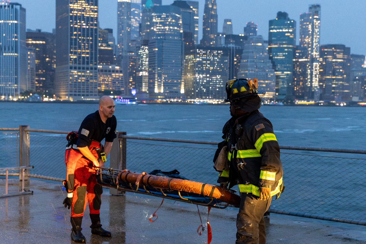 FDNY's tweet photo. As severe weather moved through New York City Saturday evening, FDNY members responded to multiple storm-related emergencies across the city.

At approximately 7:46 p.m., units responded to reports of debris falling from scaffolding near Pier 6 in Brooklyn Bridge Park. While operating at the scene, members were alerted to a person in the water nearby. FDNY Engine 224 quickly relocated to the waterfront, where members lowered a firefighter into the water and deployed portable ladders to assist with the rescue.

Working together, members safely removed the individual from the water and also assisted a second civilian who had entered the water in an effort to help the victim.

The FDNY commends the quick actions and teamwork of the members operating and reminds New Yorkers to remain alert during severe weather emergencies.