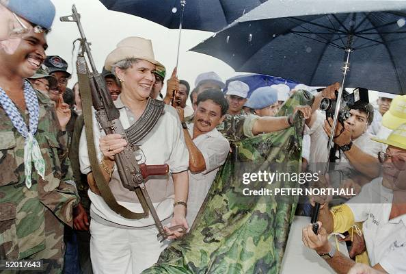 TodayInHistorye's tweet photo. June 9, 1990 (Nicaragua): President Violeta Chamorro accepted an AK-47 assault rifle from a demobilizing Contra rebel in El Almendro. This symbolic event marked the official end of the decade-long Contra War. https://t.co/9v6JtSfIJ5