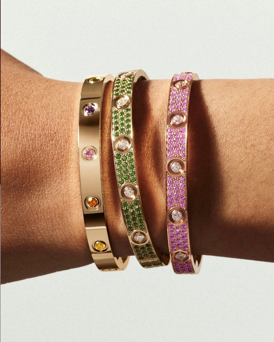 rogue's tweet photo. Cartier really leveled up the iconic Love bracelet by fully paving them in colored gemstones and diamonds https://t.co/Xh7H9UMH74