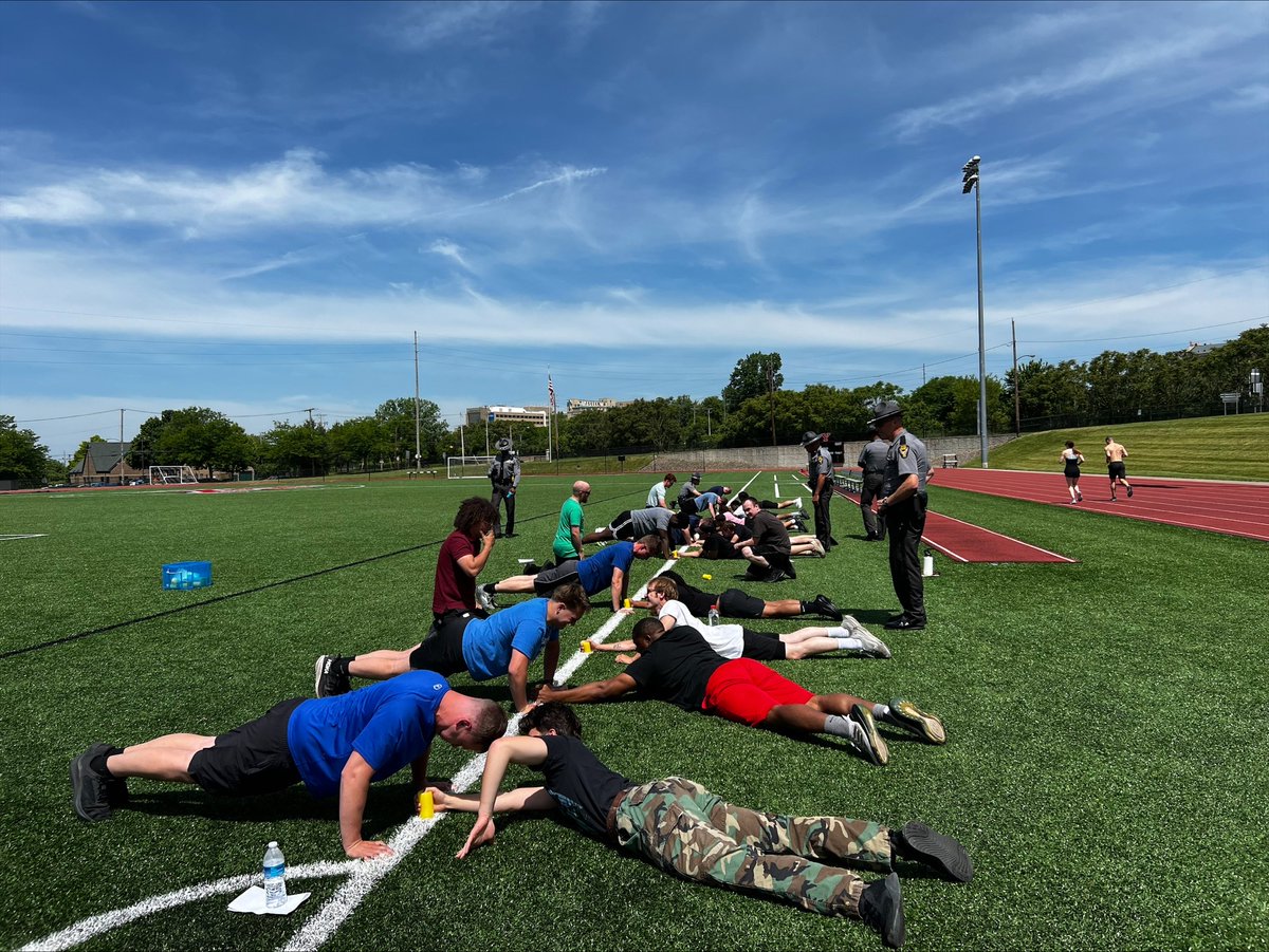 Four troopers over see the physical fitness test outside for more than 15 potential applicants. 