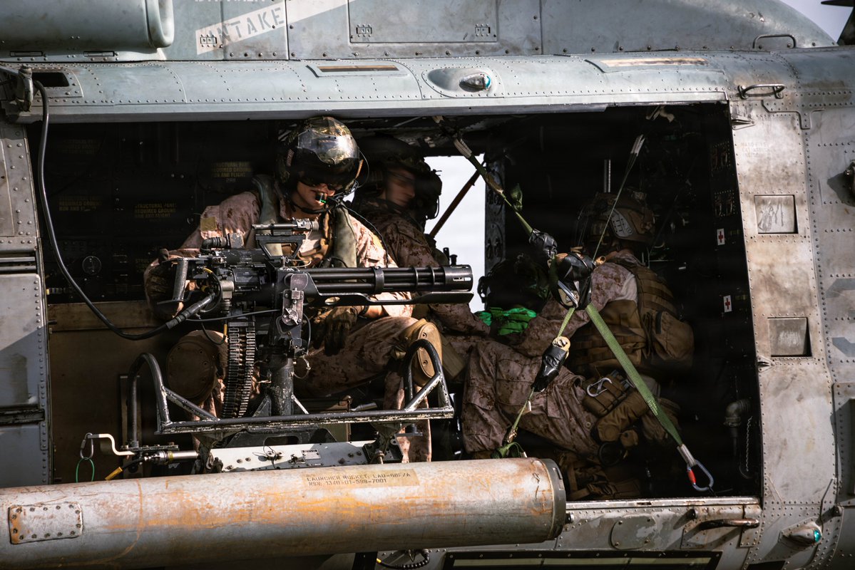 CENTCOM's tweet photo. U.S. Marines with the 31st Marine Expeditionary Unit load onto a UH-1Y Venom aboard USS Tripoli (LHA 7) to conduct aerial sniper and close air support training while transiting regional waters. https://t.co/Y6HYfgOVYJ