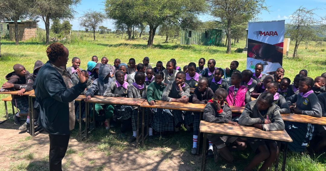 MaraElephant's tweet photo. How do you discuss the complexities of human-elephant conflict with children who experience it first-hand?

This is a question the Mara Elephant Project education team is always trying to answer, especially during educational sessions at local schools.

They approach every student engagement with authenticity, grounding conversations in real experiences of living alongside wildlife. When speaking with students aged 10-16 at Pusanki and Ngosuani Comprehensive Schools, the team was able to connect classroom learning to everyday realities in the Mara.

The discussion quickly became interactive, with students raising thoughtful questions about crop damage, safety near wildlife areas, and how to respond when elephants move close to homes and farms.

In response, the team drew on lived experience working and growing up in elephant range, sharing practical, locally relevant strategies for staying safe while also protecting wildlife and the surrounding habitat.

The message throughout was simple and honest: we were you. Concerned about living with wildlife, wanting to see change, and choosing to take action to make coexistence possible.

By the end of the session, discussions had shifted from concern to responsibility, with students actively exploring how they can play a role in protecting wildlife within their own communities.