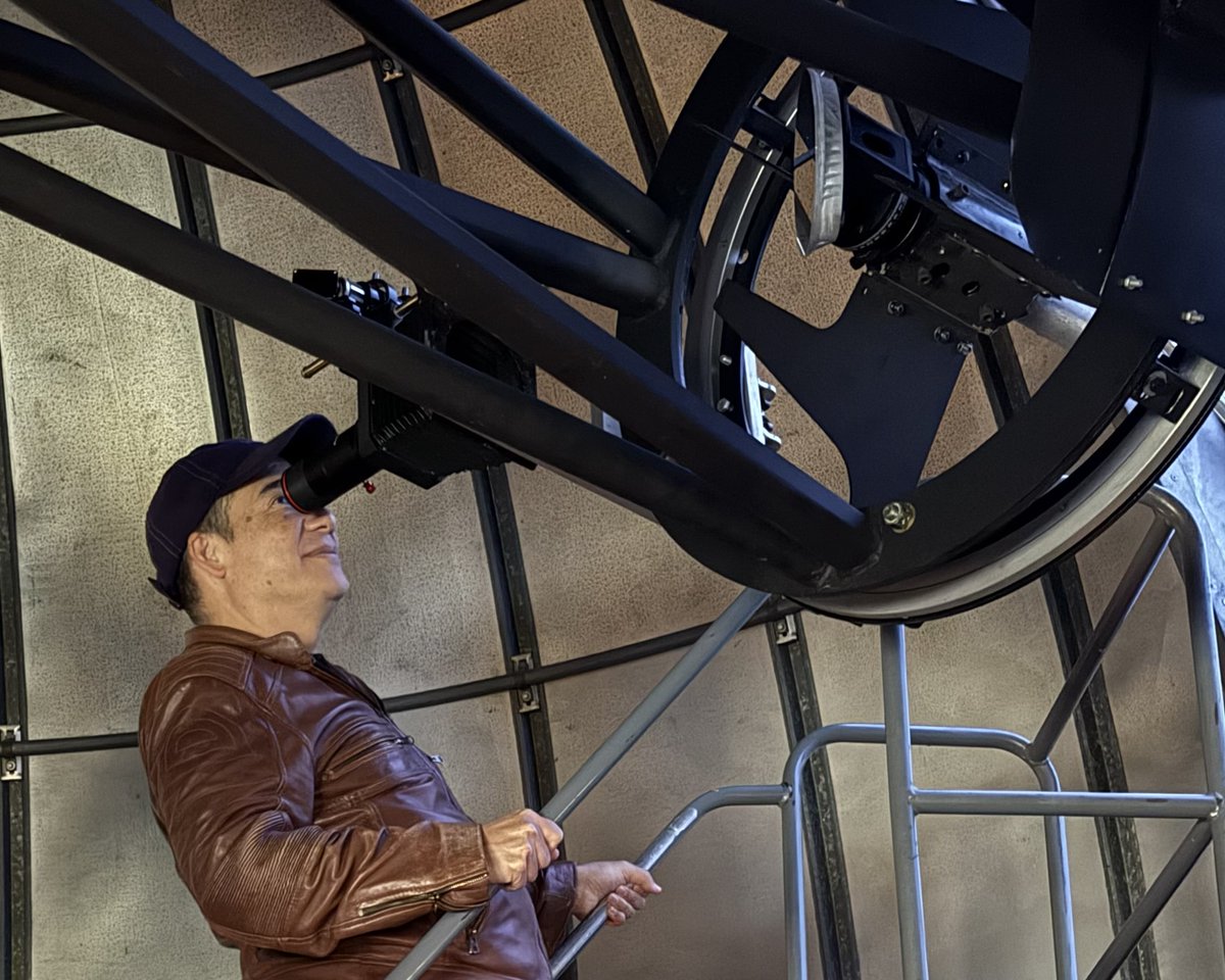 Sec. Hobbs looks through a telescope at the Goldendale Observatory.