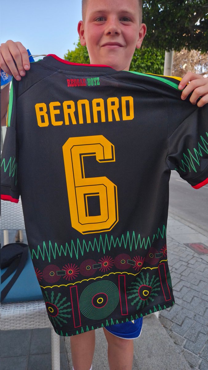 Charliej1867's tweet photo. @DishonBernard my lad had some holiday money burning a hole in his pocket, walked into a sports store an as soon as he saw the reggae boyz shirt that was that 🤣🤣 https://t.co/T8I0WYgdNK