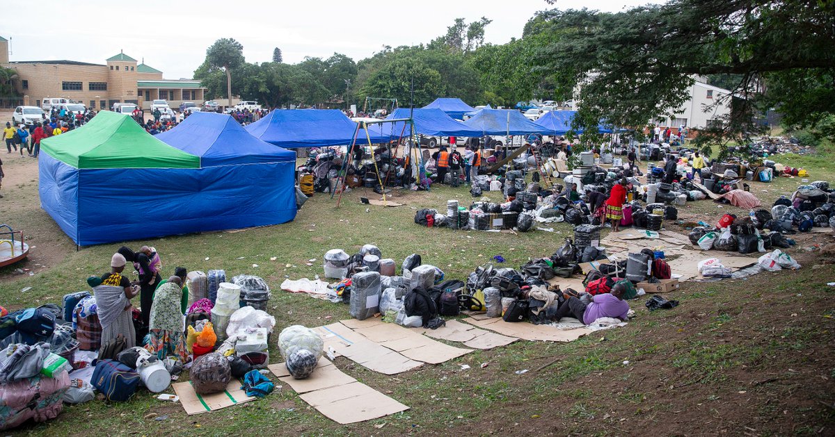 IOL's tweet photo. Approximately 500 Malawian nationals are seeking temporary shelter at Sherwood Hall in Sydenham, Durban, after fleeing violence and intimidation in the Clare Estate informal settlements. The displacement follows mounting threats and community hostility linked to an impending anti-illegal immigration deadline. Families, including roughly 30 babies and young children, are taking refuge on the playground at Sherwood Hall. Members of the South African Police Service (SAPS) Public Order Policing Unit and Durban Metro Police have been stationed at Sherwood Park to maintain order and protect the displaced group. https://t.co/bVKo1a0jW7 
📷: Leon Lestrade / Independent Newspapers.