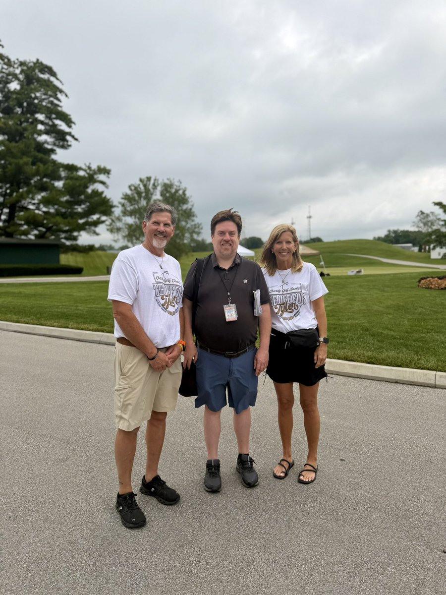theTylerTrent's tweet photo. Golf brings everyone together, but Tyler’s mission keeps this community moving. 🖤💛  Today, Tony and Kelly Trent are joined by media &amp; supporters who are helping to turn generosity into action for pediatric cancer research. Support the work: https://t.co/c2ySjX2e76. 🔗 https://t.co/WlbBpzDK1p