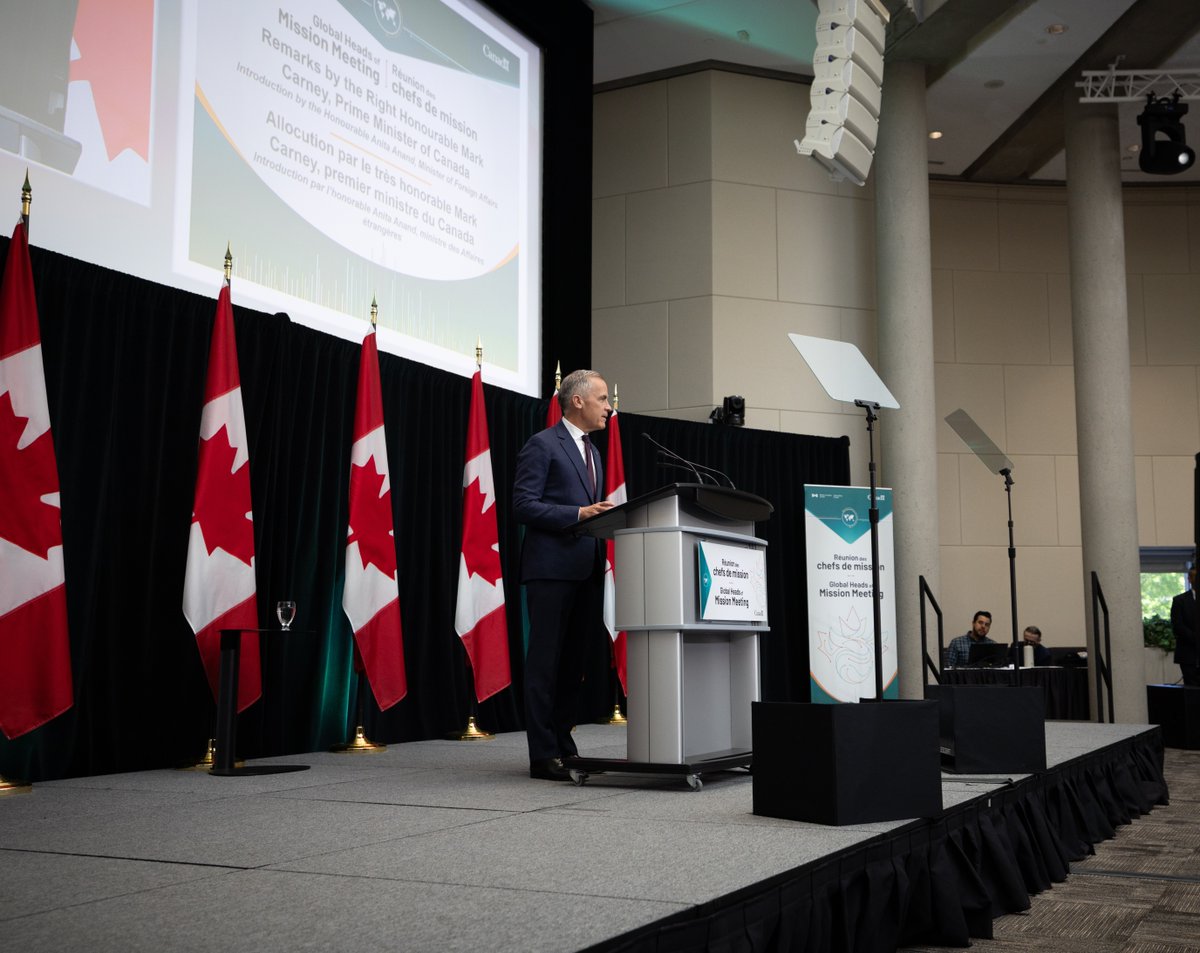 Prime Minister Mark Carney delivers remarks at a podium to Canada’s Heads of Mission during a gathering in Ottawa. 