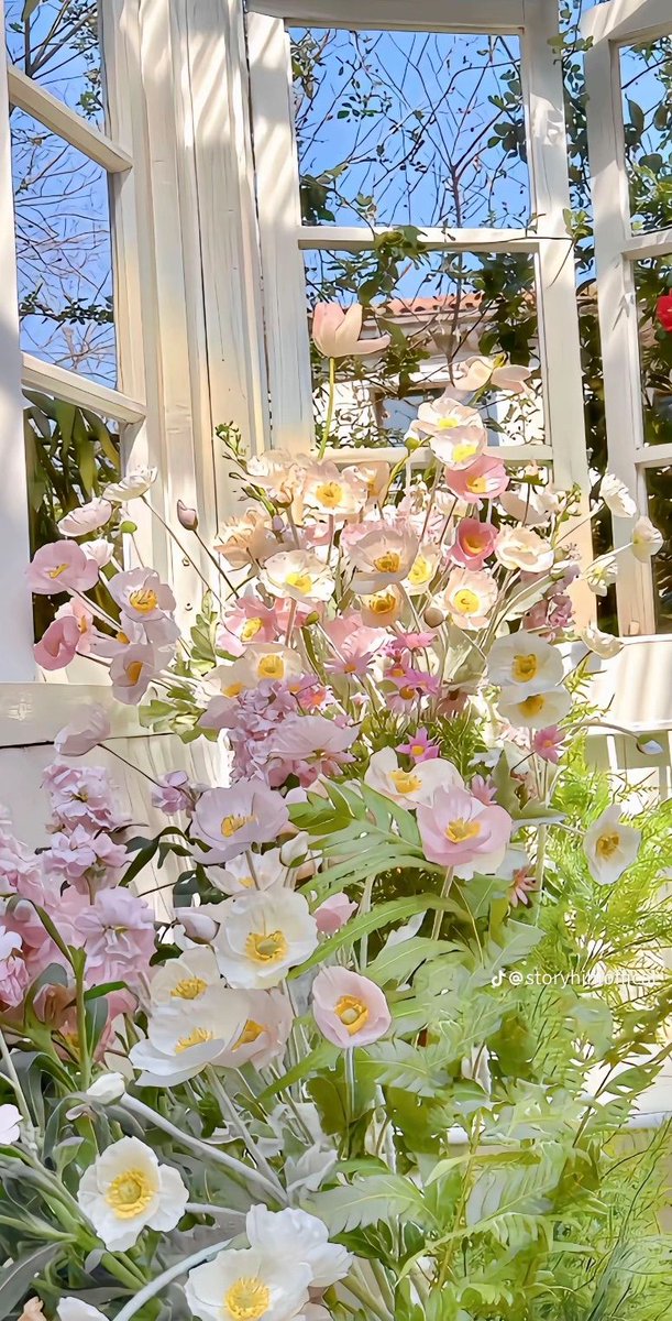 aestheticpost's tweet photo. delicate blooms spill across open windows. The garden in its gentlest, most luminous form. https://t.co/nU9xSPvEPI
