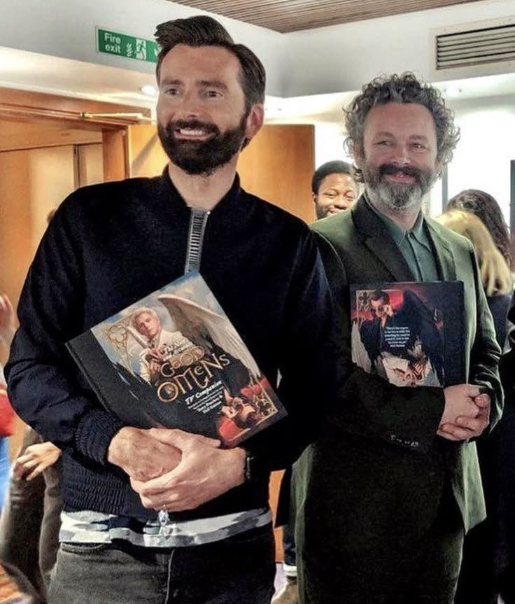 sheennxnt's tweet photo. Them both holding each other's books, David with Aziraphale and Michael With Crowley. This is one of the best https://t.co/2b9S64jkV0