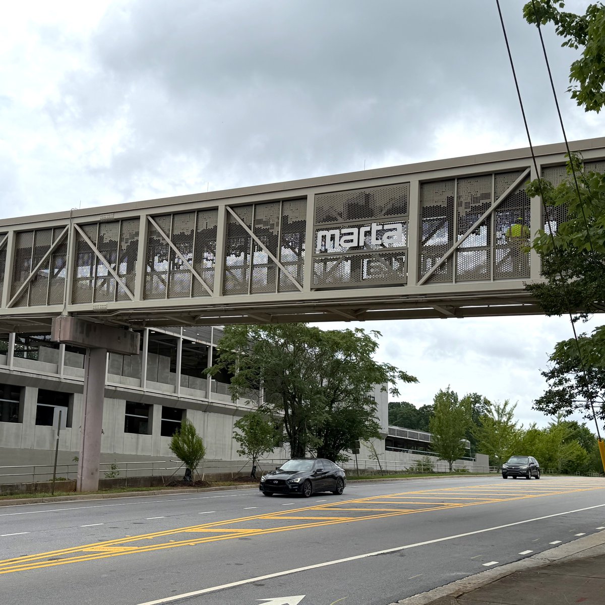 MARTAtransit's tweet photo. MARTA is excited to share that the long-awaited new south pedestrian bridge at East Lake Station is now open! 🎊👏 

Please note Route 34 boards on the south side and only a portion of the south lot is open. 
The rest of the lot will reopen soon. 

Details: https://t.co/DkGYBofG74
