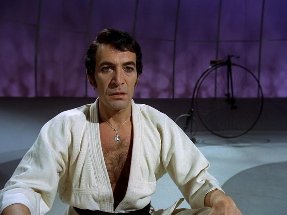 RodneyMarshall1's tweet photo. While some Number 2s have their Achilles heels, Peter Wyngarde's Village administrator is ever-vigilant. Monitoring the chess match, on his daily rounds, inspecting the Hospital's Observation Room, or in Karate meditation mode, P is a mere pawn in his game. #WyngardeWednesday https://t.co/IqBTGNWMjB