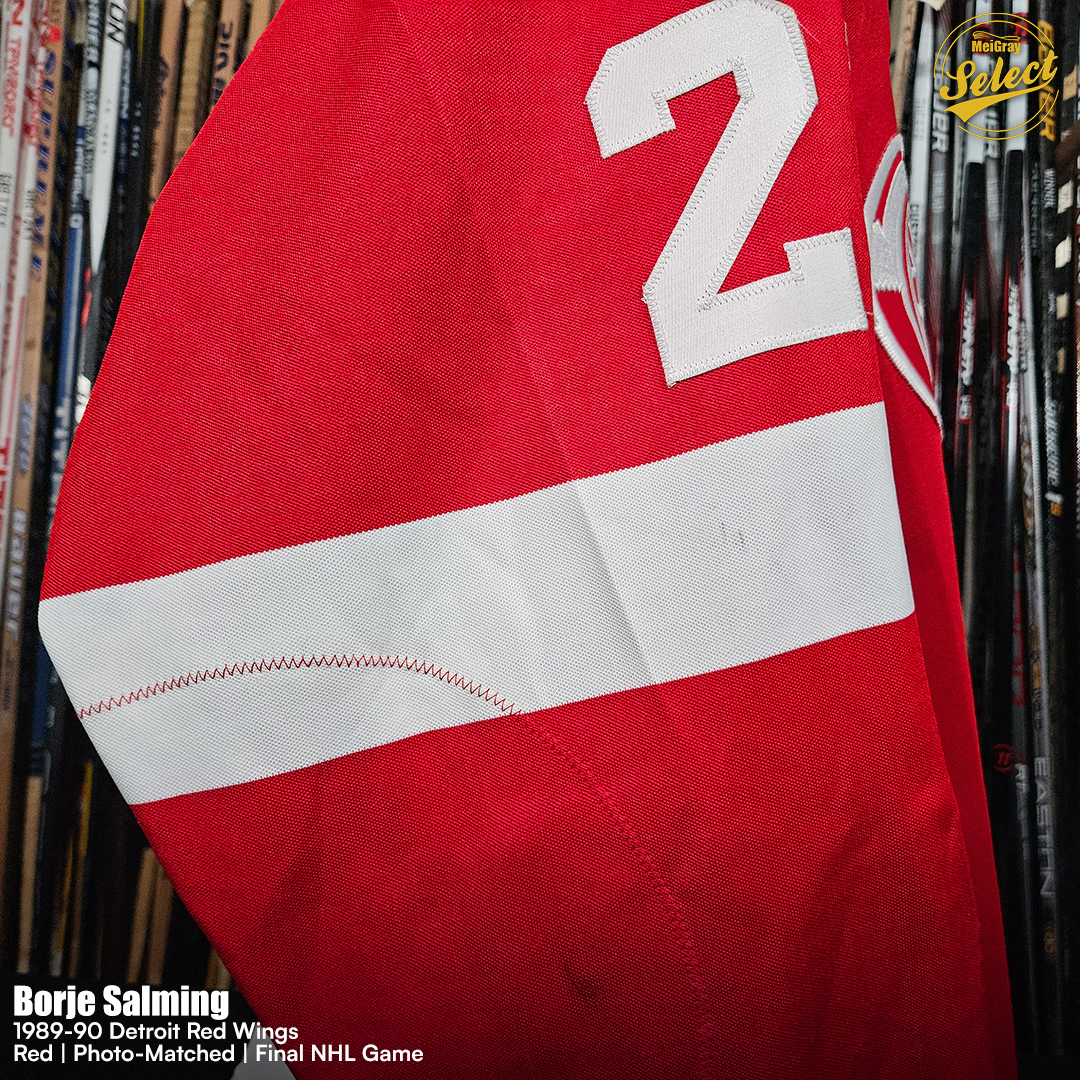MeiGray's tweet photo. Salming's Final NHL Jersey 🔥🪽

Take a look at this Detroit Red Wings red jersey worn by defenseman Börje Salming during the 1989-90 NHL season and the final game of his legendary NHL career on April 1, 1990. The jersey has been photo-matched to Detroit's 3-3 tie against the Philadelphia Flyers at The Spectrum through multiple identifying characteristics, including marks on the crest, a mark on the left sleeve number "2," and a thread on the right sleeve number "2." Salming appeared in 49 games for the Red Wings during his lone season in Detroit, recording 19 points (2 G, 17 A).

Over an incredible 17-year #NHL career, including 16 seasons with the Maple Leafs, the Swedish defenseman played 1,148 games, totaling 787 points (150 G, 637 A) while establishing himself as one of the sport's all-time greats. A six-time NHL All-Star and multiple-time James Norris Memorial Trophy finalist, Salming was inducted into the Hockey Hall of Fame in 1996 and was later named one of the NHL's 100 Greatest Players in 2017. This historic game-worn jersey is currently available on consignment in the #MeiGraySelect Collection at https://t.co/pxFg2et84Y!

🔗:https://t.co/QXCyTZ9PHf