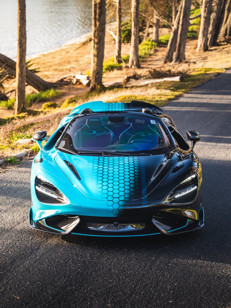 duPontREGISTRY's tweet photo. 2022 McLaren 765LT Spider | Asking Price: $1,099,888

This stunning example features a bespoke McLaren Special Operations two-tone finish in Tokyo Cyan and Tarmac Black, creating a dramatic transition that transforms the already aggressive Longtail silhouette into something entirely unique.

Every vent, aerodynamic channel, and carbon fiber surface becomes even more pronounced through the contrast of color and shadow, giving the 765LT an unmistakable visual identity from every angle.

Beneath the one-off specification remains the raw intensity that defines the LT lineage: lightweight construction, twin-turbocharged V8 power, and track-focused precision engineered without compromise.

Now available. Learn more: https://t.co/zxatVd7iC4