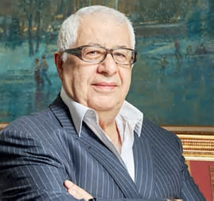 Ivory1957's tweet photo. I Have Not Forgotten — And Your Silence on the Chagoury Crime Family Is a National Disgrace

By Kio Amachree | Worldview International | The Kio Solution

I have not forgotten. And the fact that you — Nigerians at home and in the diaspora — have done absolutely nothing about Gilbert Chagoury and his criminal family is something I find profoundly disturbing and a total disgrace. A nation of 220 million people, and the collective response to one of the most brazen corruption enterprises in modern African history has been a shrug, a scroll, and silence. That silence is complicity. That silence is cowardice. And I will not share it.

Let me remind you — again — of exactly who this man is, what he has done, what he is currently doing to your country, and why your passivity in the face of it is unforgivable.

A Convicted Criminal Now Controls Nigeria’s Infrastructure

Gilbert Chagoury, the 81-year-old Lebanese-Nigerian businessman and owner of the Eko Hotel, was previously convicted by a U.S. court in 2000 for money laundering. ￼ He was not accused. He was not investigated and cleared. He was convicted. And yet this same man today sits at the very centre of Nigerian state power, collecting billions in public contracts from a president who calls him his closest confidant.

Chagoury was a close associate of military dictator Sani Abacha, who helped his business interests flourish during one of Nigeria’s darkest chapters. After Abacha died in 1998, Chagoury returned an estimated $300 million to the Nigerian government to secure his indemnity from possible criminal charges. ￼ That was not generosity. That was a convicted looter’s associate buying his freedom. Nigeria took the money, closed its eyes, and moved on. You moved on. This is what enabled everything that followed.

What followed was this: Chagoury entered a deferred prosecution agreement with the U.S. Department of Justice over allegations that he made illegal campaign contributions to U.S. presidential and congressional candidates, conspiring to violate federal election laws. He paid a $1.8 million fine. ￼ A man fined by American prosecutors for corrupting American democracy is simultaneously being handed the keys to Nigeria’s infrastructure budget. Does that not make you angry? It should.

The Hezbollah Allegations and the FBI Terrorism Database

This is the part that should have Nigerians in the streets. Instead, most have never even heard it.

Chagoury was barred from entering the United States and his visa request denied based on alleged links with a terrorist group. He was denied entry on grounds that he gave financial support to a Lebanese politician, Michael Aoun, whose party is in political coalition with Hezbollah, designated a terrorist organisation by the United States. ￼

A 2013 FBI intelligence report, citing raw information from a source, claimed Chagoury had sent funds to Aoun, who transferred money to Hezbollah. The source described Aoun as actively facilitating fundraising for Hezbollah. ￼ Chagoury’s name was subsequently added to a database used to screen passengers for terror links — a linkage he has denied. ￼

Let that sink in. A man whose name sits in the U.S. terrorism screening database is the same man President Bola Tinubu describes as his partner, his confidant, the man with whom — in Tinubu’s own words — one can “sleep with a still mind.” ￼ Nigeria deserves better than a president who sleeps soundly next to that record.

Thirteen Billion Dollars. No Competitive Bidding. No Accountability.

By 2026, companies linked to Chagoury — particularly Hitech Construction — had secured infrastructure projects valued at over $13 to $14 billion. The most significant is the Lagos-Calabar Coastal Highway, a 700-kilometre project estimated at between $11 and $13 billion, approximately 15.6 trillion naira. ￼

In 2024, Tinubu awarded Chagoury’s Hitech Construction the $11 billion Lagos-Calabar Coastal Highway project without competitive bidding. That decision sparked public outrage over lack of transparency, environmental concerns, and the staggering cost at a time of acute economic hardship. ￼ The outrage lasted a news cycle. Then Nigeria moved on. You moved on.

Despite the Chagoury Group’s lack of experience in the port sector, President Tinubu — who had the final say — once again placed his trust in his Lebanese confidant, awarding ITB Nigeria the Lagos ports renovation contract. ￼ The Federal Executive Council’s meeting in February 2025 selected Chagoury Group and its subsidiary ITB Nigeria for the contract. The Minister of Marine confirmed the federal government approved $1 billion for the modernisation of the Apapa and Tin Can Island seaports. ￼

Tinubu then transferred the lucrative Snake Island port terminal to Chagoury’s ITB Construction Nigeria Limited for 45 years. ￼ Forty-five years. A man convicted of money laundering has just been handed Nigerian sovereign infrastructure for nearly half a century. And you said nothing.

The Diplomatic Shield: St. Lucia, Benin Republic, and the Vatican

How does a man with this record move so freely through the world’s corridors of power? The answer is architecture — the careful construction of diplomatic protection and political proximity.

Chagoury serves as an ambassador to the Vatican for the tiny island nation of St. Lucia. His network of contacts stretches from Washington to Lebanon to the Holy See, and his website shows him photographed with Pope Francis. ￼ He has also served as economic adviser to President Mathieu Kérékou of Benin, and as ambassador to UNESCO. ￼ His wife Rose-Marie Chamchoum has links to Niger Republic. ￼

This is not a businessman. This is a geopolitical operation wearing a businessman’s suit — embedded across West African governments, Vatican diplomacy, Caribbean diplomatic passports, and French high society. He owns a seven-bedroom hilltop mansion in Beverly Hills, his name is on a gallery at the Louvre and a medical school in Lebanon, and he has received awards for generosity to the Catholic Church. ￼ Philanthropy as camouflage. Prestige as armour.

The Final Insult: Nigeria’s Second Highest National Honour

If everything above did not move you, this should.

In January 2026, President Tinubu awarded Gilbert Chagoury the Grand Commander of the Order of the Niger, Nigeria’s second highest national honour. There was no official announcement through government channels. The news surfaced through a social media post by businessman Femi Otedola. Reports indicated the award had not been published in the Federal Gazette as required by law. ￼

The award was given on January 8th — Chagoury’s 80th birthday. Presidency sources confirmed its authenticity but indicated the presidency may not issue a statement on the matter. ￼

A secret national honour. Bestowed in the dark. On a convicted money launderer. On a man in the FBI terrorism database. On a man whose family business has been handed $13 billion of Nigerian public money without competitive tender. And the Nigerian people — you — have done absolutely nothing.

I Will Not Stop. The Question Is Whether You Will Start.

I write from Stockholm. I have no personal financial stake in this fight. What I have is a conscience, a father’s legacy of integrity in Nigerian public service, and an absolute refusal to normalise what is being done to 220 million people by one family, one president, and one criminal network operating in plain sight.

The Chagoury file is not closed. The SFO has been notified. The NCA has been engaged. The FBI and DEA FOIA litigation continues before a federal judge in Washington. European accountability bodies have been formally petitioned. I am not going anywhere.

But I am one man in Sweden with a Labrador and a laptop. I cannot do this alone. Nigeria cannot be rescued by diaspora writers alone — it must be demanded by Nigerians themselves. Not on social media. Not in WhatsApp groups. In courtrooms, in protests, in editorial rooms, in the National Assembly, in the streets, and at the ballot box in 2027.

The Chagoury family did not seize Nigeria alone. They were handed it, piece by piece, contract by contract, honour by honour, by a leadership class you elected and a citizenry that has grown dangerously comfortable with outrage that costs nothing and changes nothing.

That must end. And it must end now.

Kio Amachree is President of Worldview International and the author of The Kio Solution governance framework. He writes on Nigerian accountability, diaspora engagement, and democratic reform.