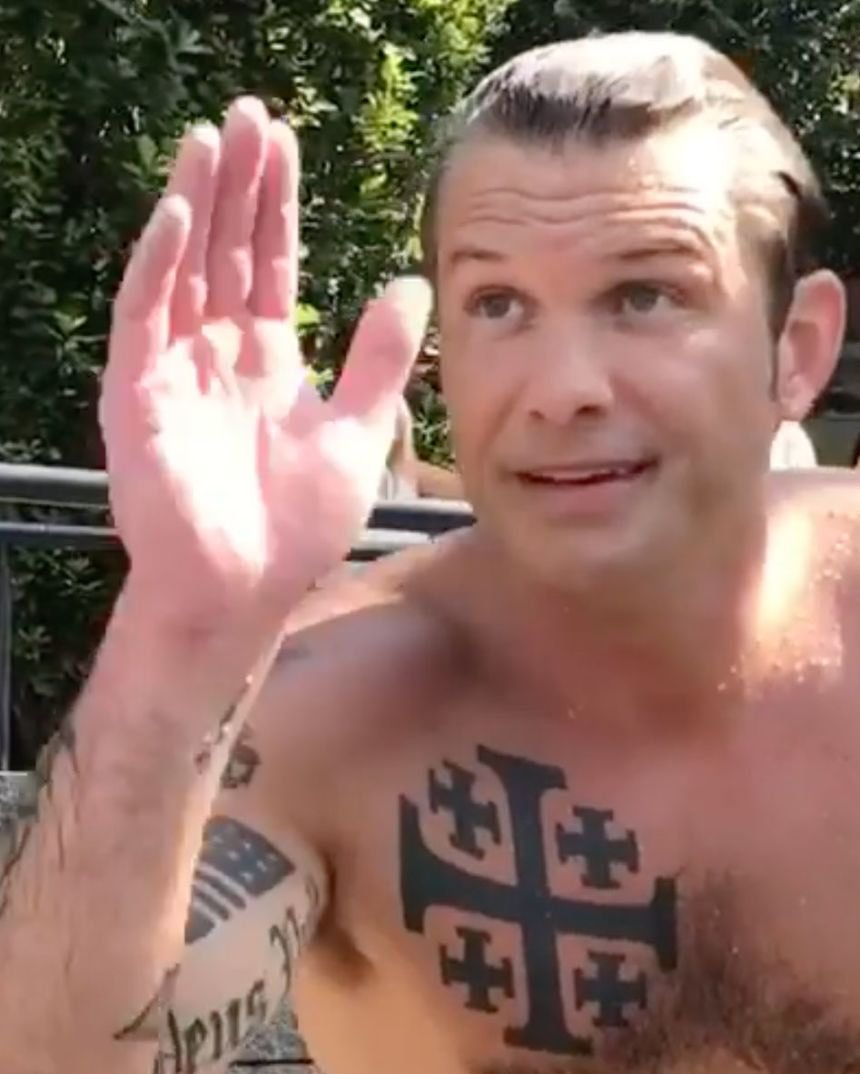 PaxHart's tweet photo. @grahamformaine It's hilarious that the people shrugging off a guy with a literal Nazi death camp tattoo are the same ones who demanded Pete Hegseth be disqualified for having a Christian tattoo because it gave them icky "Nazi" feels. https://t.co/mafT40RgXl