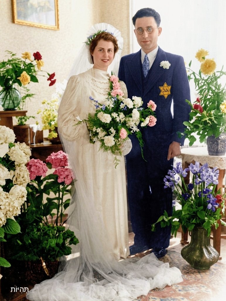 RabbiPoupko's tweet photo. When Nazi Germany occupied Hague in the Netherlands, the Jewish community there numbered around 18,000 people. 

Jews were excluded from public life and had to wear a yellow star. 

In 1942, this beautiful Jewish couple chose life even in those difficult times and got married under those circumstances. 

Later that year most Jews of the Hague were deported and murdered in Auschwitz and Sobibor.

Today, there are only about 2000 Jews living in Hague.

We will never forget.  

Photo: @historyinpic9