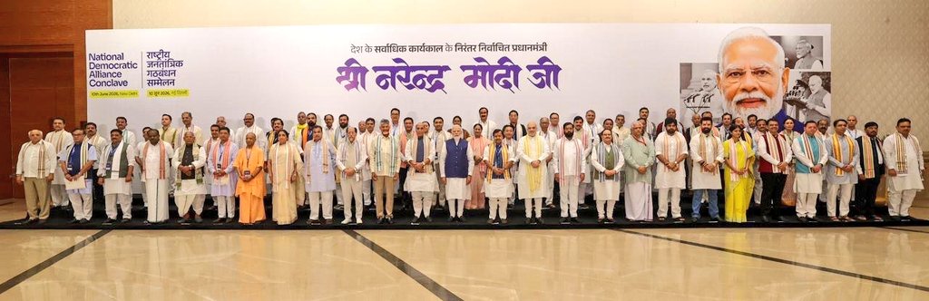 NitinNabin's tweet photo. A group photograph with Prime Minister Shri @narendramodi Ji, NDA Chief Ministers, Union Ministers and fellow NDA leaders at Bharat Mandapam. 

A reflection of our Collective Thinking, Collective Resolve and Collective Dream of a Viksit Bharat.

#LongestServingElectedPMModi https://t.co/XxgNrFGIPN