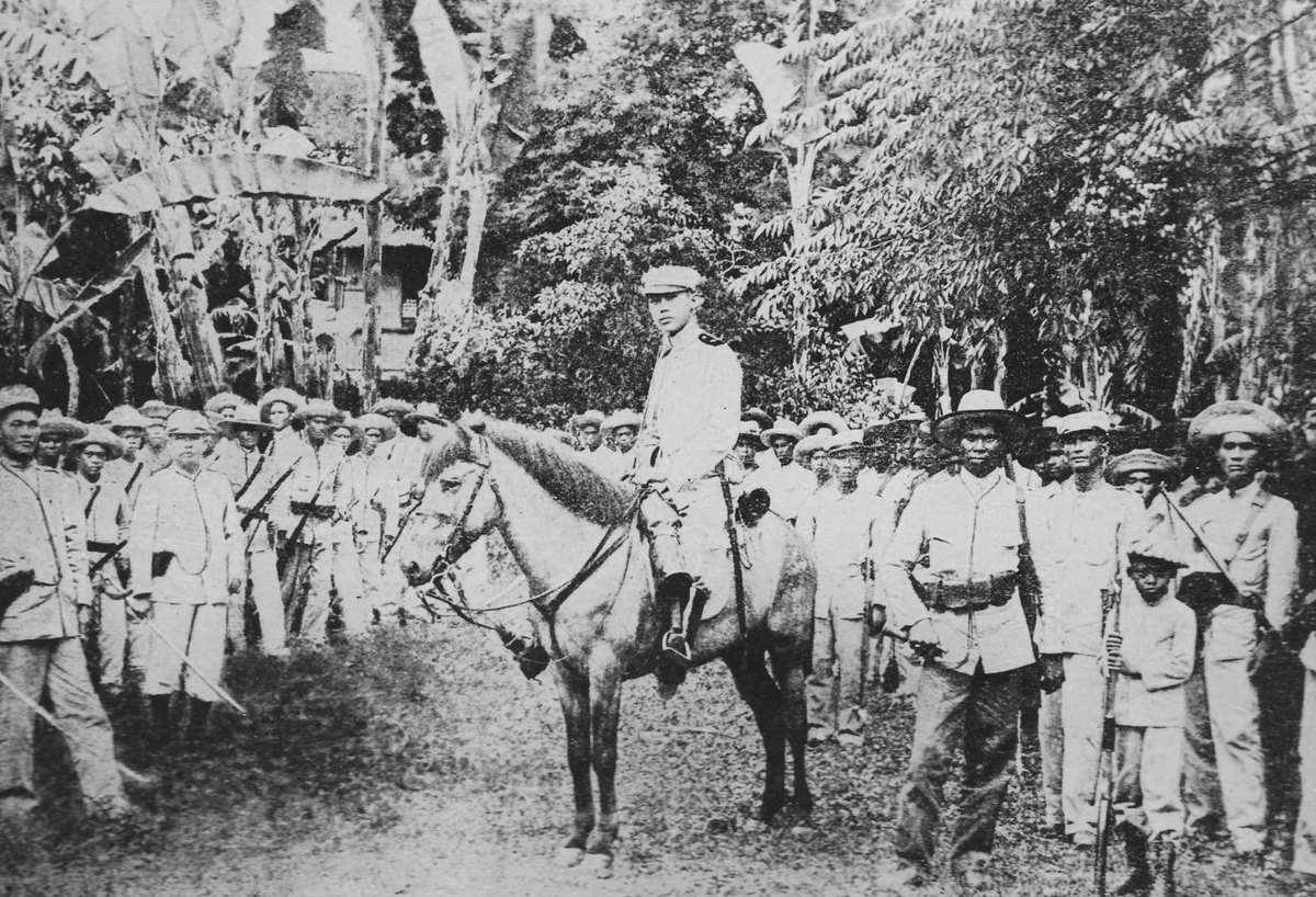 LeeCamp's tweet photo. 🚨 The First US War Overseas Was A Genocide—It Was Erased From History 🚨

During the Spanish-American War, which was largely created by US propaganda, the US went after Spanish colonial territories — one of those being the Philippines. In the Battle of Manila Bay in 1898, the US won a decisive victory, destroying the Spanish Pacific fleet. Afterward, one might think the Americans would turn around and sail home, singing sea shanties with grog in hand. …But no.

President McKinley decided it made more sense to try to take over the entire Philippines even though few Americans knew what it was or where it was. About this decision, McKinley stated:

    “One night late, it came to me this way. There was nothing left for us to do but to take them all, and to educate the Filipinos and uplift them and Christianize them, and by God’s grace do the very best we could for them, as our fellow men for who Christ also died.” (Quotes are from the book "Overthrow".) 

It’s unclear if the hundreds of thousands of Filipinos who would die in McKinley’s pursuit felt uplifted by the experience. Also interesting is the fact that McKinley believed there was “nothing” else he could do but subjugate, oppress, convert, and control the Filipino people. Apparently no one made him aware of the idea of leaving them alone. (I bet when he heard about that years later, it was a real head-smack moment.)

Prior to the arrival of the Americans, there were already Filipino guerrilla forces fighting against the Spanish colonizers. After the Battle of Manila Bay, the head of those forces, Emilio Aguinaldo, met with Commodore George Dewey, the head of the US naval force. The two of them differed on what happened at that meeting. Aguinaldo believed they had agreed to defeat Spain together, at which point the Filipino people would have their independence. Dewey later claimed that’s not at all what happened. But then again the two of them didn’t speak each other’s language, and there was no interpreter. Also, the United States has broken every promise it has ever made to indigenous people — so this was just par for the course.

[SIDE NOTE: Support my work (for free) by subscribing at "RealLeeCamp" on subs tack. Thanks for supporting independent media!] 

A few months later the US and Spain signed the Treaty of Paris on December 10, 1898, which brought the Spanish-American War to a close. In the agreement, the US paid Spain $20 million for the entire Philippine archipelago, which consisted of 7,000 islands and was home to 7 million people who had no idea they’d just been sold from one colonizer to another. (That means the US paid $2.85 per Filipino.)

The Filipino people proceeded with implementing their newfound independence. They approved a constitution, created a republic, and proclaimed Aguinaldo president.

    “Twelve days later, this new nation declared war against the United States forces on the islands. McKinley took no notice. To him the Filipinos were what the historian Richard Welch called ‘a disorganized and helpless people.’”

Oddly, at this time in American history, some percentage of Congress believed the US should not be a dastardly and repulsive imperial hegemon. (I know. I’m as shocked as you are.) Therefore, the Senate (for a bit) refused to ratify the Treaty of Paris.

    “Senator George Frisbie Hoar of Massachusetts warned that it would turn the United States into a ‘a vulgar, commonplace empire founded upon physical force, controlling subject races and vassal states, in which one class must forever rule and the other classes must forever obey.’” 

Ha! Can you imagine that? The US would never do something so grotesque! …except for the next 125 years and counting. (Also, my man George gets extra credit for having the middle name Frisbie.)

Hmmm, so how can America’s ruling psychopaths get Congress to play along with the subjugation of 7 million Filipinos? I bet those pesky politicians would change their tune if the US forces in the Philippines were attacked by the barbarians who lived there. Oh, what do you know?! That’s exactly what happened next!

During the Senate’s debate, the Filipino rebels attacked the American forces in Manila. This helped push the Senate to finally ratify the treaty. …But it was later revealed that the American troops actually fired the first shots. So we can see the US tradition of false flags used to drag us into bloody wars goes back quite a way. (Apparently, the long arc of history bends towards repeating itself.)

In the battles that followed, the Filipinos—up against superior US weaponry—used every guerrilla tactic they could think of in order to defend their land, families, villages, and lives. The Americans responded with genocide. In just one example:

    “General Wheaton ordered every town and village within twelve miles to be destroyed and their inhabitants killed.” 

The US military worked to stop any reporting of the ethnic cleansing from getting back to the home audience. Eventually, in 1901, some of the extent of the horror made its way into US newspapers. Average Americans found out the troops were using torture, rape, and ethnic cleansing to subdue the local population. They rarely differentiated between combatants and noncombatants.

    “‘We have actually come to do the thing we went to war to banish,’ the Baltimore American lamented. The Indianapolis News concluded that the United States had adopted ‘the methods of barbarism,’ and the New York Post declared that American troops ‘have been pursuing a policy of wholesale and deliberate murder.’”

Of course, plenty of US newspapers fell all over themselves to defend the genocidal colonizers. Can you guess which rag led the way?

    “The New York Times argued that ‘brave and loyal officers’ had reacted understandably to the ‘cruel, treacherous, murderous’ Filipinos.”

In early 1902, President Theodore Roosevelt had succeeded the recently assassinated McKinley. In yet another moment of foreshadowing, Roosevelt — pretending to care — pushed for hearings in the Senate to address the charges of misconduct by American forces. Teddy then got his allies to steadfastly limit the scope of the hearings. The committee never even issued a final report. As with the Warren Commission on the assassination of JFK and the 9/11 Commission, the mere appearance of an effort to “figure it out” was enough to distract the American public. The commissions never got to the truth, nor were they meant to.

By July of 1902, Teddy Roosevelt announced that the Philippines had been pacified. Most of the rebel leaders had been killed, and the indigenous population had given up its resistance.

    “In three and a half torturous years of war, 4,374 American soldiers were killed… About 16,000 guerrillas and at least 20,000 civilians were also killed. Filipinos remember those years as some of the bloodiest in their history. Americans quickly forgot that the war ever happened.” 

Britannica puts the death toll higher:

    "An estimated 20,000 Filipino combatants were killed, and more than 200,000 civilians perished as a result of combat, hunger, or disease."

The first time US troops ever fought overseas they committed genocide. It does not seem that much has changed over 125 years. 

[NOTE: Support my work (for free) by subscribing at "RealLeeCamp" on subs tack. Thanks for supporting independent media!]