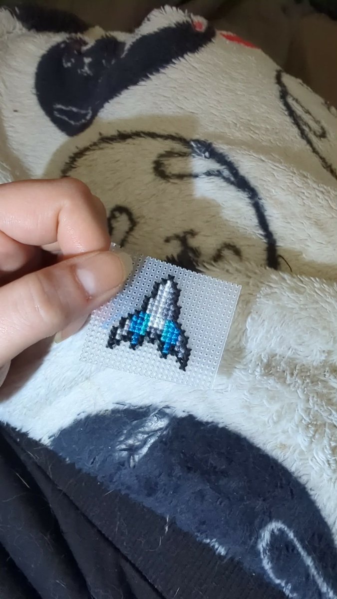 Halfsan's tweet photo. Making an Arwing cross stitch pin. 
#starfox https://t.co/RRx8MFehkL