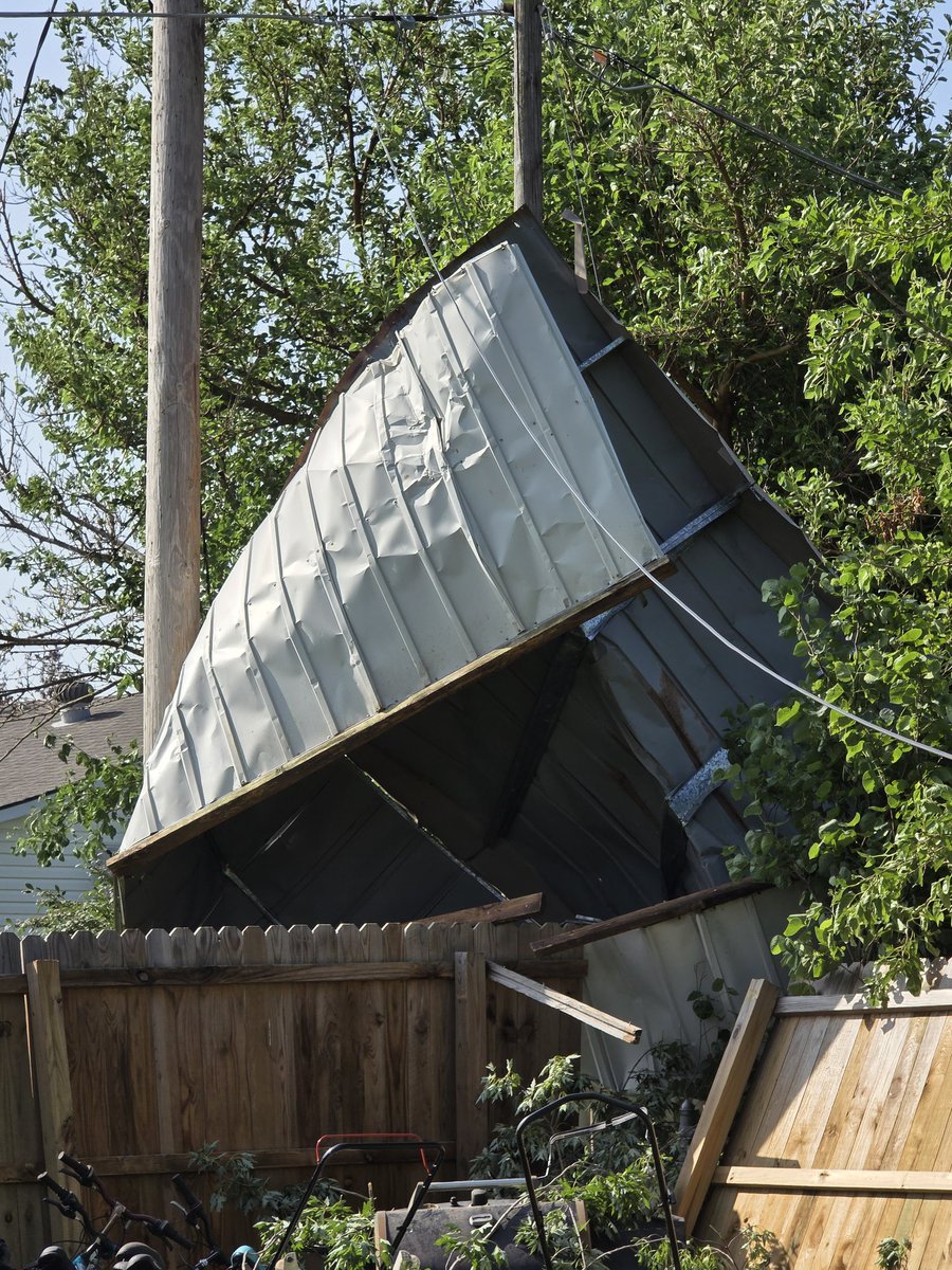 tboyer02's tweet photo. @thistle_ki35141 @JaydonShawwx I just do not want any more in Salina! I still have no electricity and my shed is still wedged between the two poles and on my fence. Waiting on energy to come out and tell me how I can remove it without taking out somebody else's lines! https://t.co/n9d6uA6ILg