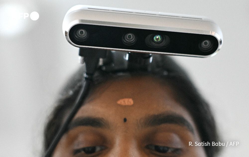 AFP's tweet photo. The Indian workers training AI robots to take their jobs.

Paid to have a camera strapped to their foreheads, a growing army of thousands of AI system trainers in the world's most populous country are teaching machines how to move like humans in the real world – from folding towels to factory work
https://t.co/QrPvODw5ou