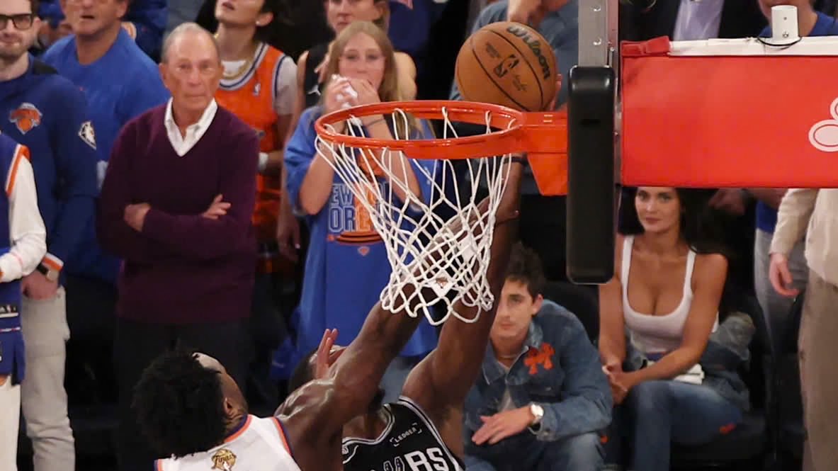 JonnyRoot_'s tweet photo. Rewatching the OG Anunoby’s “block” on De’Aaron Fox at the end of Game 4 & it looks like he may have gotten away with a foul…

It looks like the force of OG hitting Fox’s arm is what caused the ball to only softly hit the backboard. Fox retains firm possession of the ball even as OG seems to slightly tip it in Fox’s lay-up progression.

In the NBA, slight contact with the ball does not automatically make all subsequent contact legal.

It’s still a bonehead play by Fox to go for the lay-up imo, but did the Knicks get away with a foul?