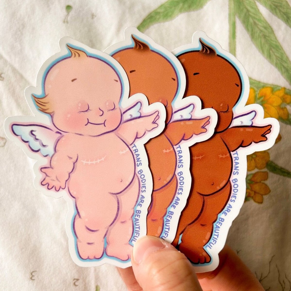 Yuri_Is_XX's tweet photo. TRAs will sell stickers depicting babies with their 'breasts' cut off, and then act dumb when we say that they target the youth or that their movement has pædophilic overtones. https://t.co/j9wHnXIDTV