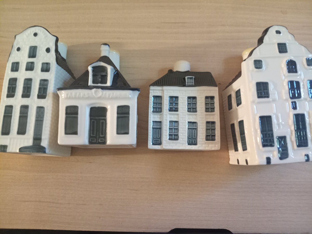 JoshuaJens75167's tweet photo. I bought these little porcelain Amsterdam houses yesterday for a total of $2 to resell since they go for $30 each. BUT at home I heard liquid inside. They're really from KLM Dutch Airline given as souvenir, and these still have Bols gin inside WIN WIN gimme Dutch gin! https://t.co/JlqCQ7vhou