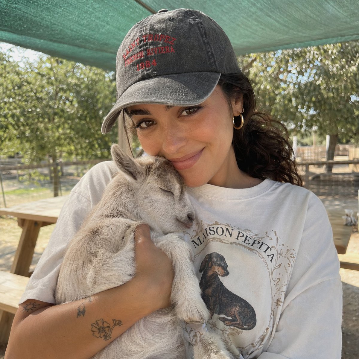 Girl with Baby Goat Candid Portrait