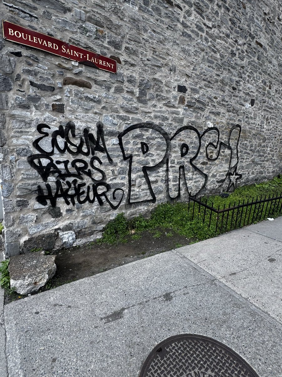 OldMtlGuide's tweet photo. Why can’t @MTL_Ville clean off this vandalism at one of the busiest intersections in Old Montreal? Shameful defacing of a heritage building should be addressed quickly. https://t.co/iFo6jc8evO