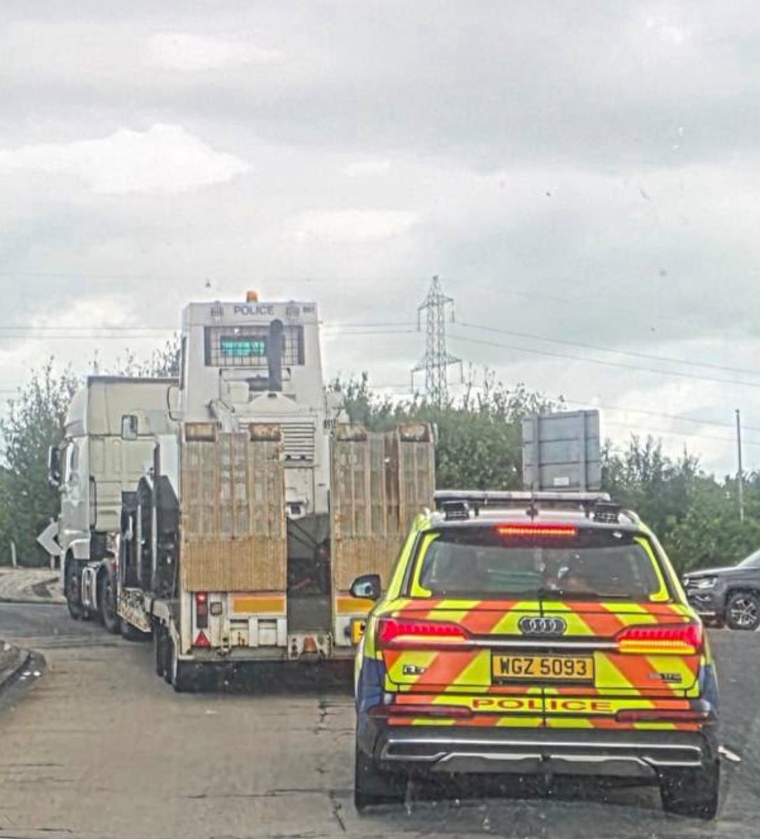 Kscott_94's tweet photo. Update: A police bulldozer has been transported to Belfast to assist with clearing roads and blockades.

The vehicle is very rarely deployed.

It comes after a subdued third night of disorder, one house was set alight and several bins burnt in Belfast @BelTel https://t.co/nyVX43ABeq