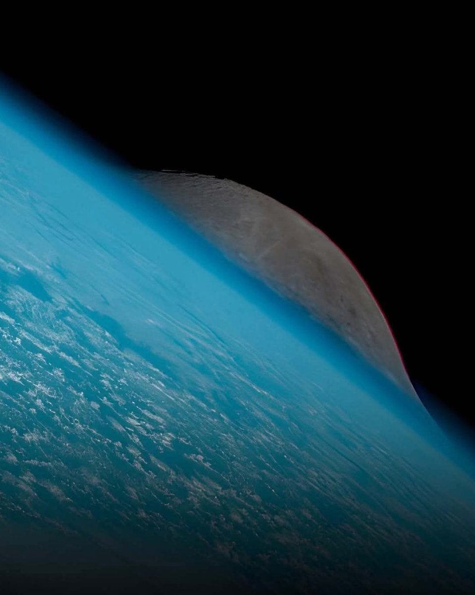 konstructivizm's tweet photo. Moon Photobombs Earth – Captured by Himawari-9!Japan’s Himawari-9 weather satellite, sitting in geostationary orbit at ~35,800 km (22,236 miles) above the equator, caught this stunning view: the Moon peeking out from behind Earth’s curve.What makes the image even more extraordinary is the dramatic optical illusion caused by atmospheric refraction. As the Moon appears near Earth’s limb (the edge), its light bends through the dense layers of our atmosphere, stretching and warping the lunar disk — giving it that surreal, almost “melting” https://t.co/jf4F7ZJkNe

This is a real photo — not an artist’s concept. The satellite was imaging the full Earth disk when our natural satellite decided to make a surprise cameo.Atmospheric refraction is the same phenomenon that makes the Sun and Moon look flattened or distorted when they rise or set from the ground. From space, it creates this otherworldly effect when the Moon grazes Earth’s horizon.A beautiful reminder of how physics turns routine weather satellite imagery into cosmic art.