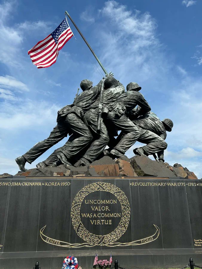 since1775's tweet photo. June 12, 1961: President John F. Kennedy signs a proclamation directing the American flag to fly 24/7 over the Marine Corps War Memorial in Arlington. https://t.co/Rr16v909V9