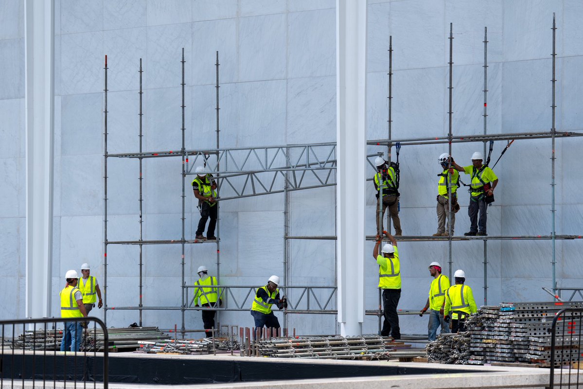 PenguinSix's tweet photo. Work crews are setting up scaffolding under the Donald Trump sign at the Kennedy Center. For @Bloomberg https://t.co/EcSxguvdrc